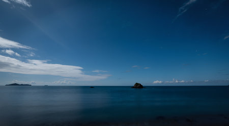 Beautiful seascape with a small island in the distance.の素材