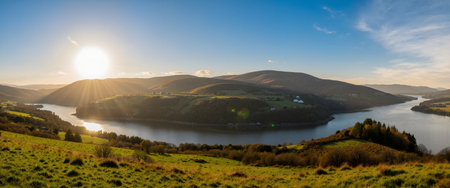 Beautiful winter landscape with snow covered mountains and lake in the background.の素材
