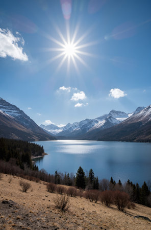 Mountain lake with snow-capped mountains in the background.の素材