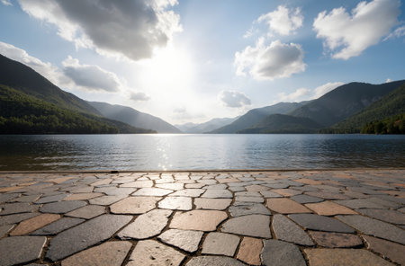 Beautiful landscape of a lake in the mountains at sunset with stonesの素材