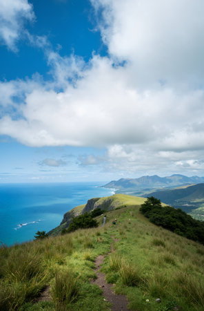 View from the top of the mountain to the sea and blue sky with cloudsの素材