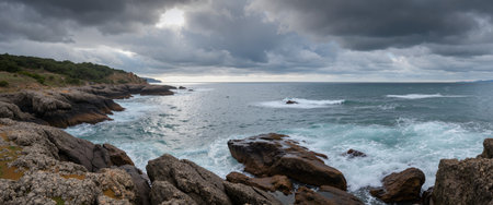 Panoramic view of the sea and rocks on a cloudy dayの素材