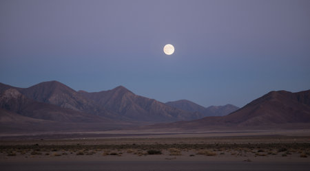 Moon rising over the mountains in the Death Valley National Park, Californiaの素材