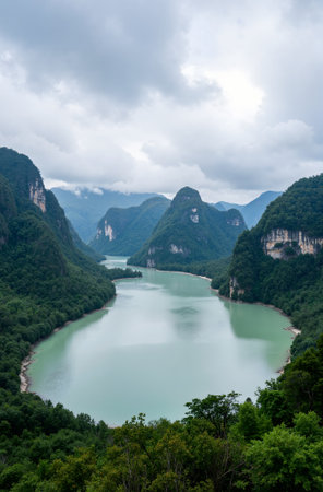 Mountain landscape with clear blue sky and sunbeams in the backgroundの素材