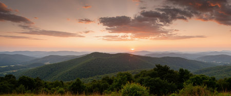 Panoramic view of the mountains at sunset. Beautiful summer landscape.の素材