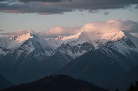 Mountain landscape with snow covered peaks at sunset. Caucasus Mountains, Georgia.の素材