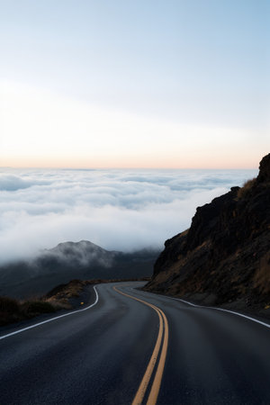 Mountain road through the clouds at sunrise. Tenerife, Canary Islands, Spainの素材