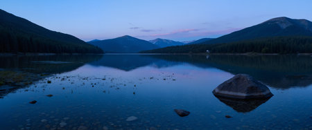 Mountain lake with reflection in the water at sunset. Beautiful landscape.の素材