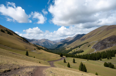 Mountain landscape with blue sky and clouds, Kyrgyzstanの素材