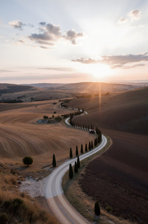 Sunset in Tuscany, Italy. Rural landscape with roadの素材