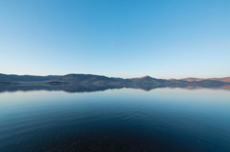 Reflection of mountains in the water. Lake Baikal.の素材