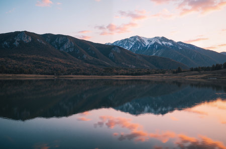 Reflection of mountains and clouds in the lake at sunrise, New Zealandの素材