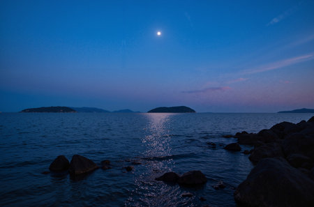 The moon over the sea in the evening on the island of Koh Samuiの素材