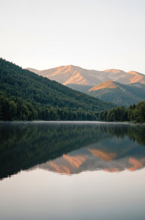 Beautiful landscape image of a lake in the mountains at sunrise.の素材