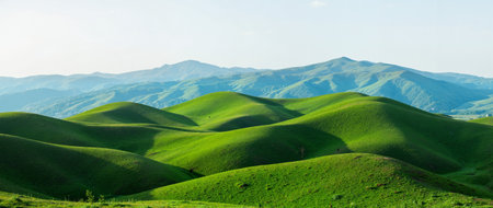 Beautiful landscape with green hills and blue sky. Panorama.の素材