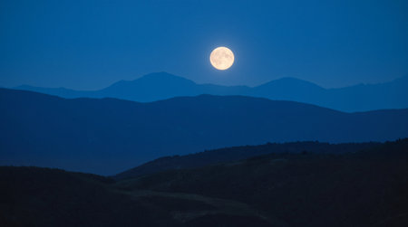 Beautiful winter landscape with frozen lake and pine trees at sunset.の素材