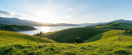 Panoramic view of the lake and mountains at sunset. Summer landscape.の素材