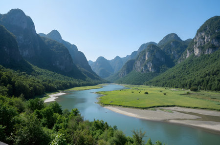 Mountain landscape with river and forest at sunny day in summer.の素材