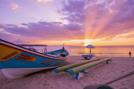 Colorful fishing boat on the beach at beautiful sunset time in Thailandの素材