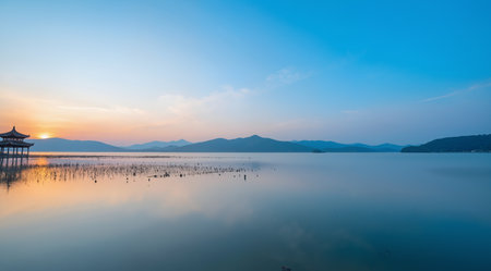 Sunset at the lake in Hangzhou, China. Long exposureの素材