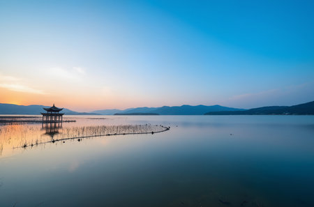 Beautiful sunset at the lake in Hangzhou, China. Long exposureの素材