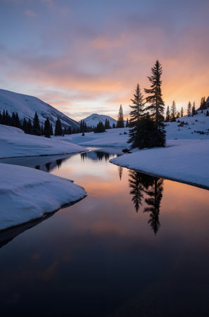 Mountain lake at sunset. Beautiful winter landscape in the mountains.の素材