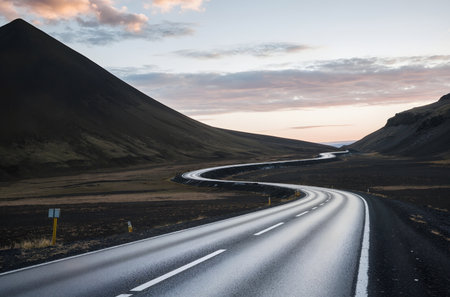 Icelandic landscape with road and mountains at sunset. Travel destinationの素材
