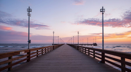 Wooden pier on the Baltic Sea at sunset in Kolobrzeg, Polandの素材