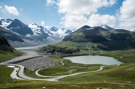 Alpine alpine landscape with lake and snow-capped mountainsの素材