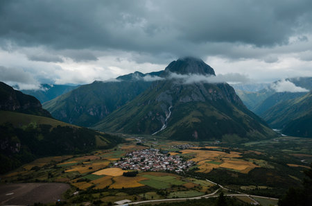 Aerial view of the village and mountains in the clouds. Georgiaの素材