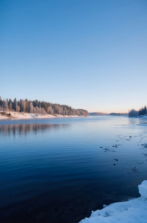 Frozen lake in the winter. Beautiful winter landscape with frozen lake.の素材