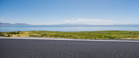 empty asphalt road to the sea in summer, panoramic viewの素材