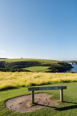 Landscape view of a golf course with a blue sky in the backgroundの素材