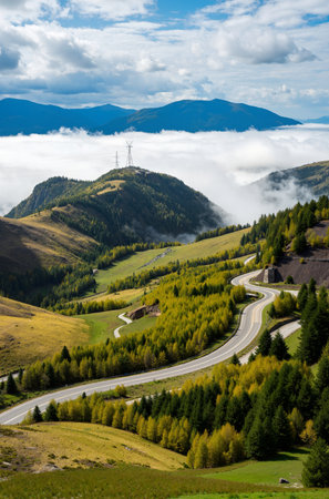 Mountain landscape with road and high voltage transmission line in the cloudsの素材