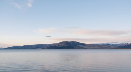 Landscape of a lake and mountains at sunset in the north of Icelandの素材