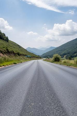 Asphalt road in the mountains. Summer landscape with blue sky.の素材