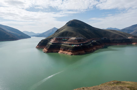 The dam on the lake in the mountains of Kyrgyzstanの素材