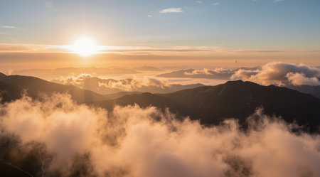 Sunrise over the clouds in the mountains. Panoramic view.の素材