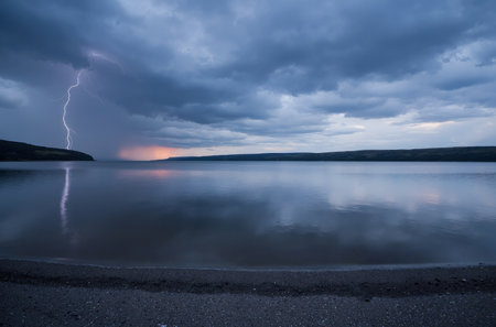 Stormy sky over the lake in the evening. Long exposure.の素材