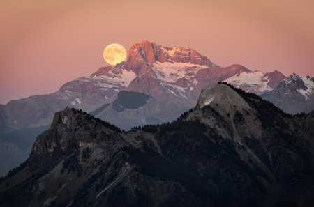 Full moon over the mountains in the evening, Italy, Europe.の素材