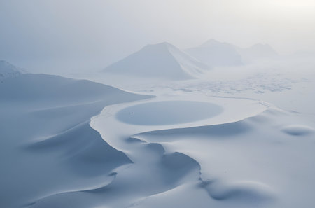 Beautiful winter landscape with snow covered mountains in the mist. Toned.の素材
