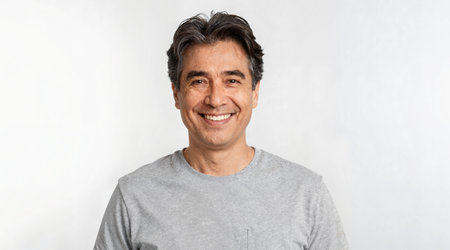 Portrait of Asian man in gray t-shirt on white backgroundの素材