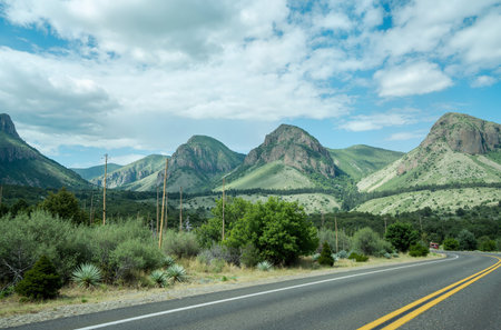 Road in the mountains with blue sky and white clouds. USA.の素材