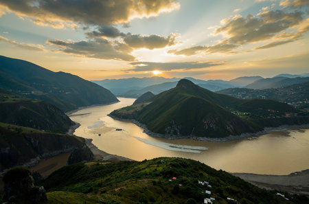 Sunset over the mountains and the river in Lugano, Switzerlandの素材