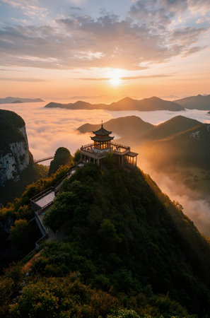 Aerial view of pavilion and pagoda in the mountains at sunrise.の素材