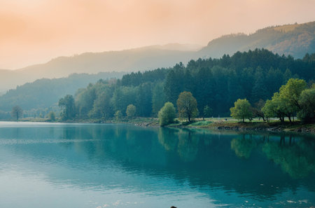 Beautiful landscape with mountain lake and forest in the morning time.の素材