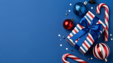 Christmas decoration on blue background with copy space. Top view. Flat lay.の素材