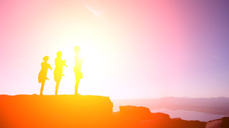 Silhouette the healthy women groups practicing yoga on the mountain in nature.