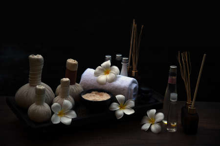 Spa massage compress balls, herbal ball on the wooden with treaments spa; Thailand, soft and select focusの写真素材