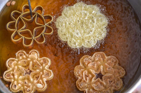 Crispy Lotus Blossom Cookie; Dessert of Thailand; Thailand  name "Dok Jog" Crispy Lotus Blossom Cookie made from flour, coconut milk, sugar, salt, sesame and fry in a pan with hot oil.の写真素材